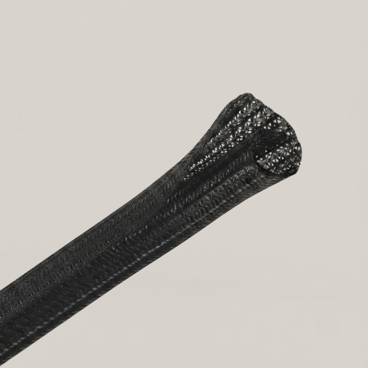 Selbstschließender Kabelschlauch HALO in Schwarz - Mesh-Geflecht bündelt TV-Kabel